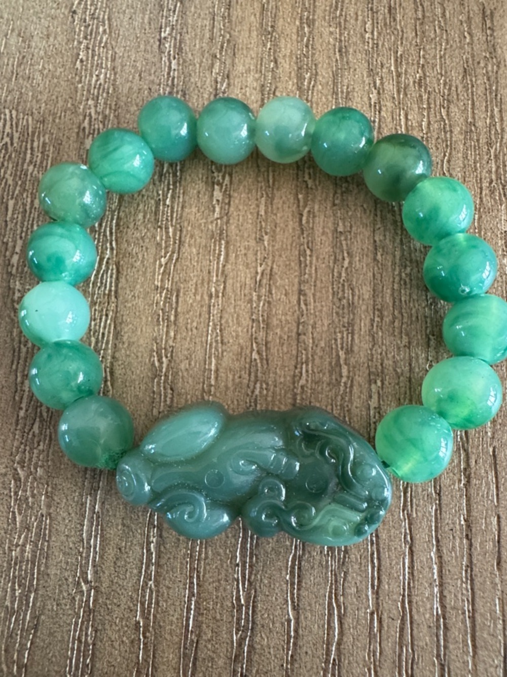 Green Beaded Bracelet with Carved Jade-Style Charm